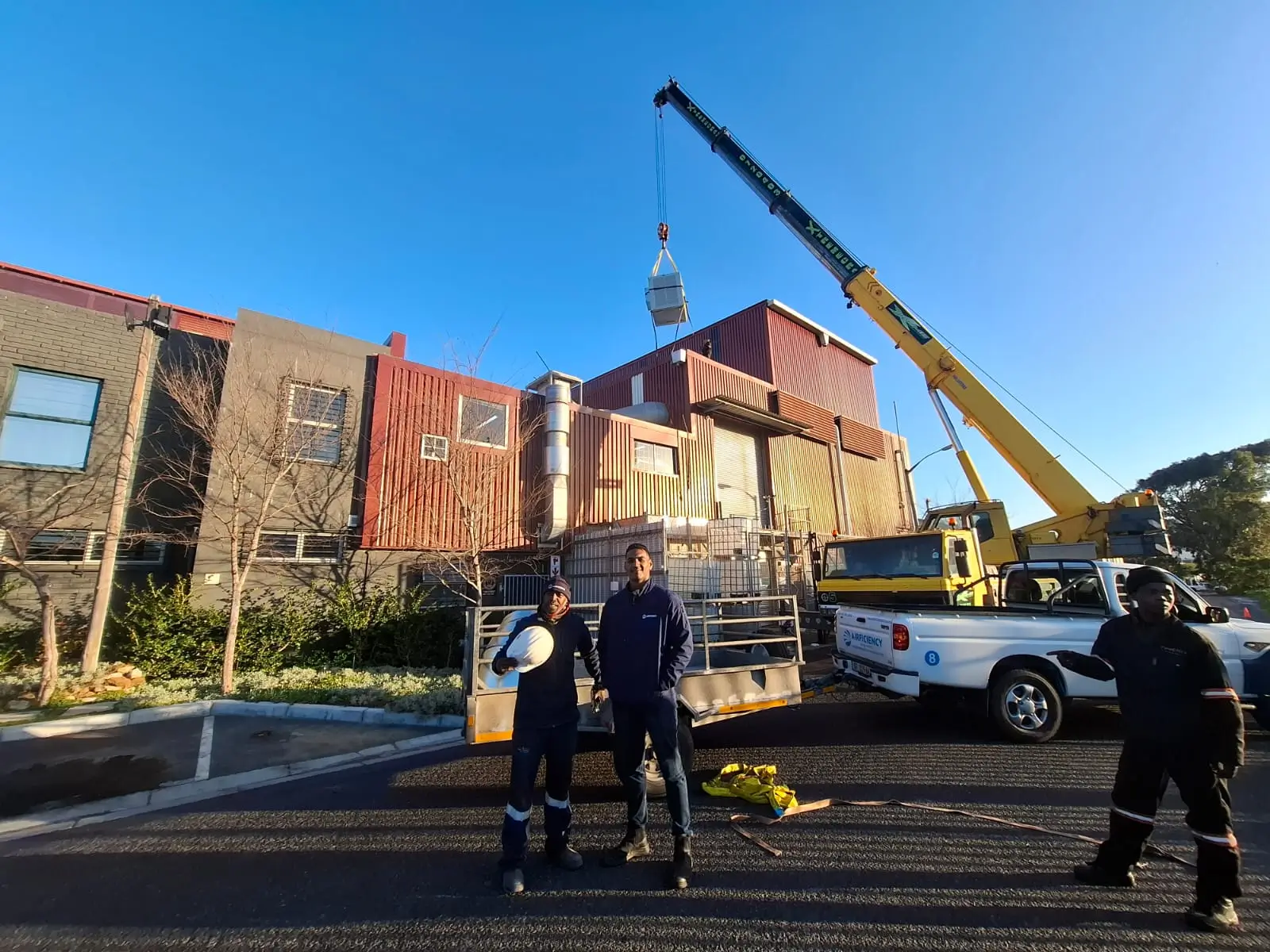Aircon installation team standing on job site in Cape Town