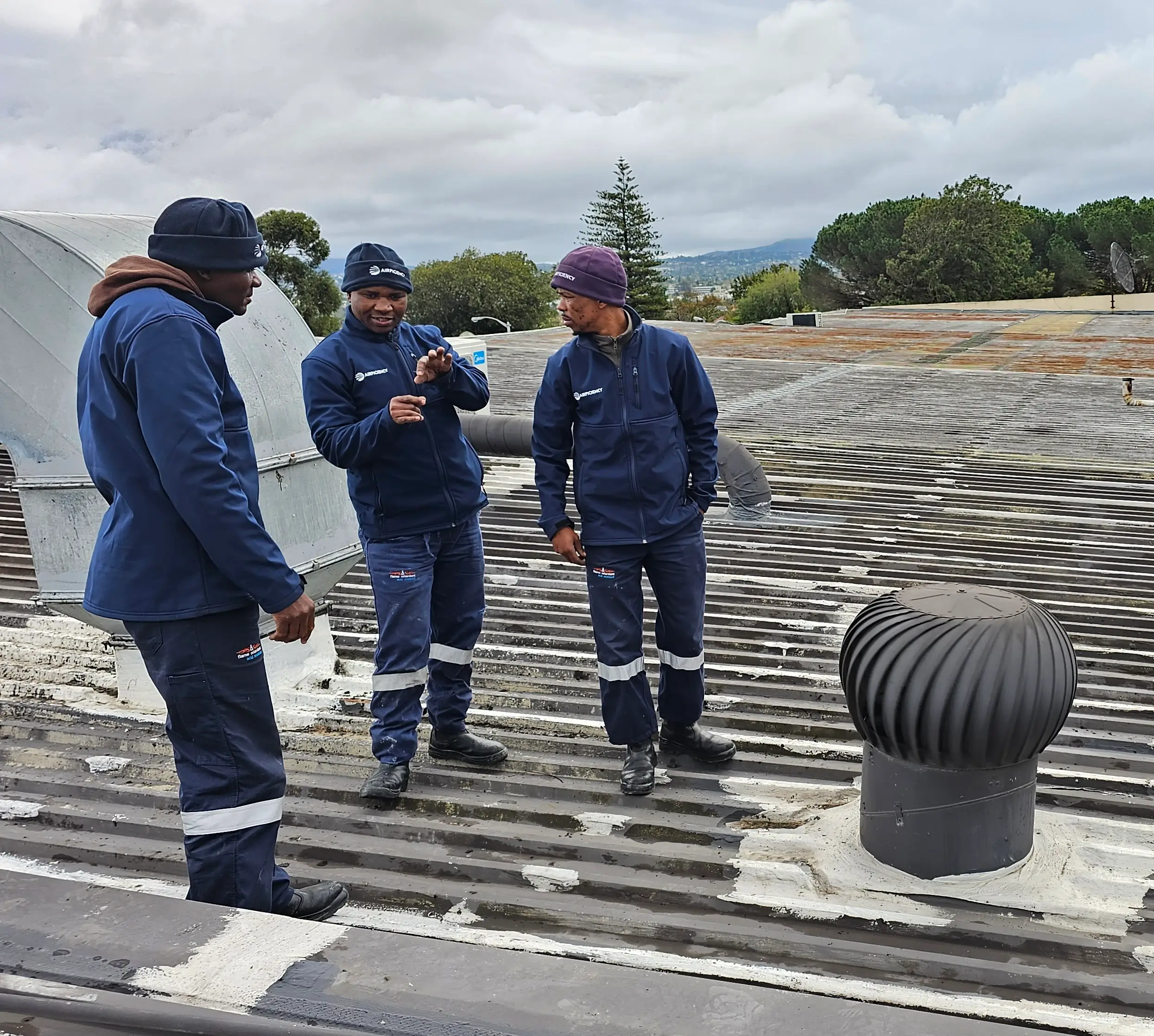 HVAC technician discussing air conditioning installation with client